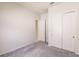 Bedroom with neutral walls and carpet, showcasing a spacious closet and bright, airy feel at 13828 Tybee Beach Ln, Orlando, FL 32827