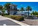 Welcoming community entrance sign with water feature and lush landscaping at 13828 Tybee Beach Ln, Orlando, FL 32827