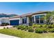 Beautiful single-story home showcasing a well-maintained lawn, appealing landscaping, and a two-car garage at 13828 Tybee Beach Ln, Orlando, FL 32827