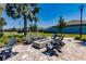 Outdoor fire pit area with comfortable seating and beautifully landscaped surroundings, perfect for gatherings at 13828 Tybee Beach Ln, Orlando, FL 32827