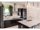 Well-lit kitchen features stainless steel appliances, a modern tile backsplash, and quartz countertops at 13828 Tybee Beach Ln, Orlando, FL 32827
