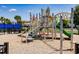 Community playground featuring various play structures, slides, and climbing equipment at 13828 Tybee Beach Ln, Orlando, FL 32827