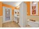 Bathroom with an elongated vanity, ample cabinet space, and a bright, airy feel at 14143 Conifer Dr, Orlando, FL 32832