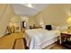Bedroom with a plush bed, soft lighting, and warm, neutral color palette at 14143 Conifer Dr, Orlando, FL 32832