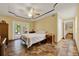 Cozy bedroom with stylish flooring, a ceiling fan, and access to a private deck at 14143 Conifer Dr, Orlando, FL 32832