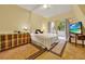 Bedroom with a large bed, balcony access, and unique ceiling architecture at 14143 Conifer Dr, Orlando, FL 32832