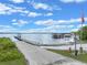 Boat launch and docks on a serene lake with clear skies above at 14143 Conifer Dr, Orlando, FL 32832