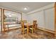Cozy dining room featuring warm lighting and an adjacent room with a pool view at 14143 Conifer Dr, Orlando, FL 32832