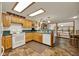 Bright kitchen with wooden cabinetry, updated appliances, and lots of natural light at 14143 Conifer Dr, Orlando, FL 32832