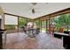 Spacious screened-in patio with comfortable seating, perfect for outdoor dining and relaxation at 14143 Conifer Dr, Orlando, FL 32832