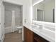 Modern bathroom features marble tile, ample vanity space, and well-lit mirror at 14501 Grove Resort Ave # 2103, Winter Garden, FL 34787
