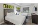 Comfortable bedroom featuring two beds, stylish decor, and ample natural light at 14501 Grove Resort Ave # 2103, Winter Garden, FL 34787