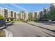 Stately condo building with beautiful landscaping, circular drive and porte cochere at 14501 Grove Resort Ave # 2103, Winter Garden, FL 34787