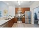 Well-equipped kitchen featuring stainless steel appliances, sleek cabinetry, and ample counter space for meal preparation at 14501 Grove Resort Ave # 2103, Winter Garden, FL 34787