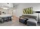 Open living space with a comfortable sofa, dining area, and modern décor, seamlessly connecting relaxation and dining at 14501 Grove Resort Ave # 2103, Winter Garden, FL 34787
