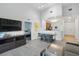 Spacious living area with an open layout, connecting the living room, dining area, and kitchen for easy living and entertaining at 14501 Grove Resort Ave # 2103, Winter Garden, FL 34787