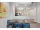 Modern living room boasts an open floor plan with dining area and contemporary kitchen at 14501 Grove Resort Ave # 2103, Winter Garden, FL 34787