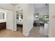 Inviting living room with hardwood floors that leads to a cozy bedroom suite at 14501 Grove Resort Ave # 2103, Winter Garden, FL 34787