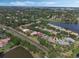 Aerial shot of a property highlighted with white outline nestled in a tree-lined neighborhood by the lake at 1570 Westover Loop, Lake Mary, FL 32746