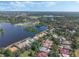 Picturesque aerial of homes bordering a lake with community amenities and beautiful landscaping, offering a tranquil setting at 1570 Westover Loop, Lake Mary, FL 32746