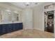 Bathroom with travertine floors, double vanity and plenty of space at 1570 Westover Loop, Lake Mary, FL 32746