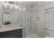 Bright bathroom featuring a marble sink, elegant lighting, and frameless glass shower at 1570 Westover Loop, Lake Mary, FL 32746