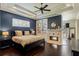 Primary bedroom with fireplace, en-suite, tray ceiling, and custom closet at 1570 Westover Loop, Lake Mary, FL 32746