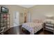 Cozy bedroom with dark wood floors, decorative accents, and en suite bathroom at 1570 Westover Loop, Lake Mary, FL 32746
