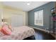 A calming bedroom with a ceiling fan, window, and closet at 1570 Westover Loop, Lake Mary, FL 32746
