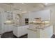 Spacious kitchen features white cabinetry, granite countertops, and stainless steel appliances at 1570 Westover Loop, Lake Mary, FL 32746