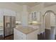 Kitchen showcasing granite countertops, stainless steel refrigerator, and custom white cabinets at 1570 Westover Loop, Lake Mary, FL 32746