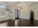 Open-concept living room with dark hardwood floors and elegant architectural details at 1570 Westover Loop, Lake Mary, FL 32746