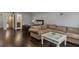Open concept living room with a comfortable couch and partial view of the bedroom and en suite bathroom at 1570 Westover Loop, Lake Mary, FL 32746