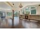 Sun-filled living room with fireplace, high ceilings, and views of the pool and lanai at 1570 Westover Loop, Lake Mary, FL 32746