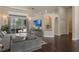 Comfortable living room featuring a modern sofa, stylish decor, and natural light at 1570 Westover Loop, Lake Mary, FL 32746