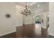 Expansive living area with dark hardwood floors, neutral walls, and elegant lighting at 1570 Westover Loop, Lake Mary, FL 32746
