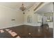 Open floorplan with high ceilings, wood floors, and view into eat-in kitchen at 1570 Westover Loop, Lake Mary, FL 32746
