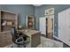 This office features built in shelving, hard wood floors and an office chair at 1570 Westover Loop, Lake Mary, FL 32746