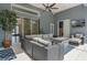 Relaxing outdoor patio featuring stylish wicker furniture, a ceiling fan, and a mounted TV at 1570 Westover Loop, Lake Mary, FL 32746