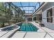 Screened-in pool and jacuzzi with a spacious deck area perfect for outdoor lounging at 1570 Westover Loop, Lake Mary, FL 32746