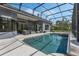 Spacious screened-in pool area with comfortable outdoor seating and a beautiful backyard at 1570 Westover Loop, Lake Mary, FL 32746