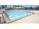 Community lap swimming pool with clear water, lane dividers and ample deck space with furniture for lounging at 1570 Westover Loop, Lake Mary, FL 32746