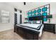 Beautifully decorated bedroom with a modern black and white design and pops of turquoise at 1781 Sawyer Palm Pl, Kissimmee, FL 34747