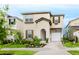 Charming two-story home with a well-manicured lawn, neutral color scheme and an attached one car garage at 1781 Sawyer Palm Pl, Kissimmee, FL 34747