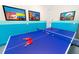 Game room featuring a blue ping pong table, decorative paddles, and fun underwater artwork at 1781 Sawyer Palm Pl, Kissimmee, FL 34747