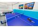 Features a ping pong table and air hockey, perfect for entertainment and fun, with a vibrant color scheme at 1781 Sawyer Palm Pl, Kissimmee, FL 34747