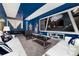 Cool game room with Star Wars theme, large screen, and comfortable white couches at 1781 Sawyer Palm Pl, Kissimmee, FL 34747