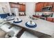 Beautiful open concept kitchen with granite counters, stainless appliances, and island seating at 1781 Sawyer Palm Pl, Kissimmee, FL 34747