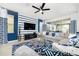 Bright, stylish living room with blue accent wall, comfortable seating and decor at 1781 Sawyer Palm Pl, Kissimmee, FL 34747