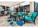 Screened patio offers stylish seating, dining area, and beautiful rug for outdoor entertaining and relaxation at 1781 Sawyer Palm Pl, Kissimmee, FL 34747
